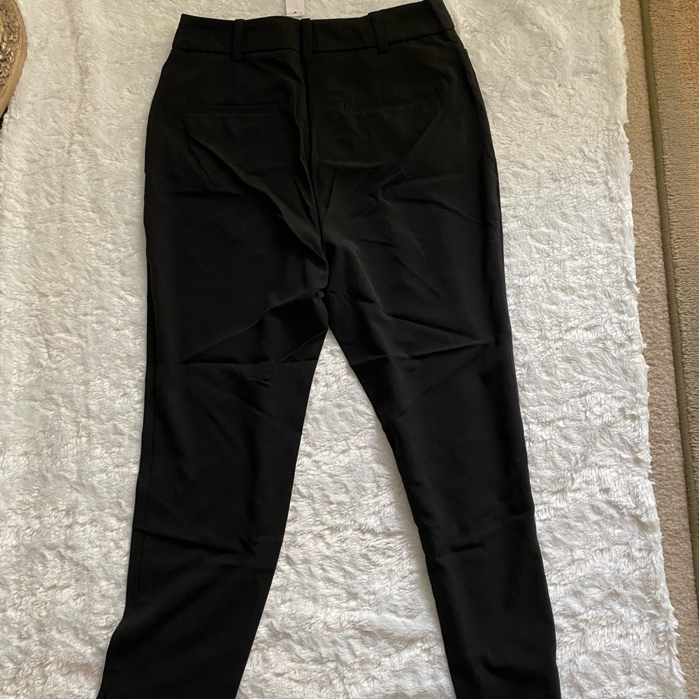 NEW York & Co tall black pant size 12 new. It has a slit at the end of the leg
